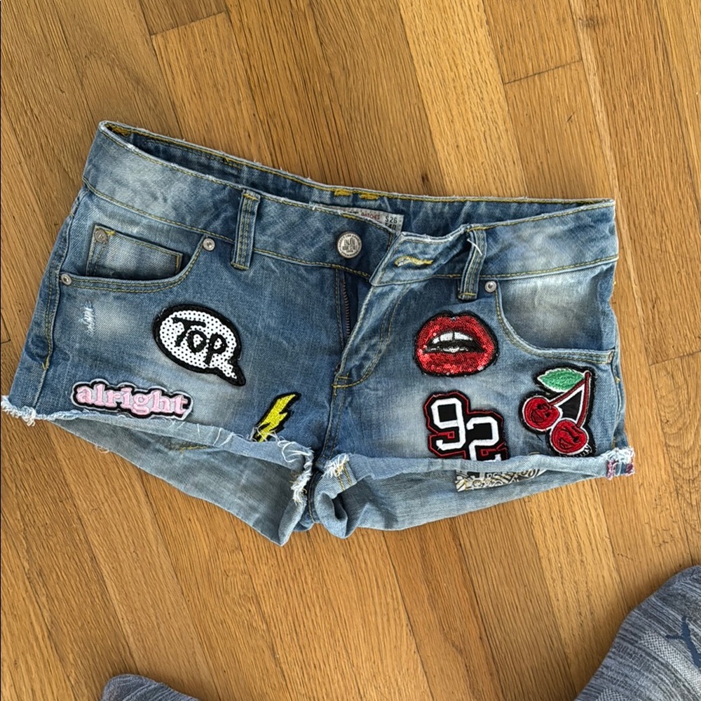 Alcott Blue Jean Shorts with Distressed Hem and Patches